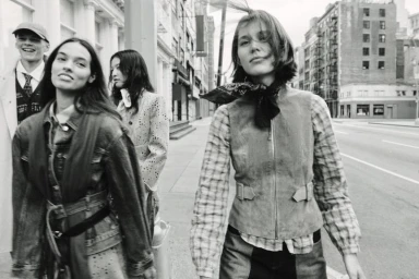 Group of four models walking on a city street in black and white fashion campaign photography for Zara Western Codes.