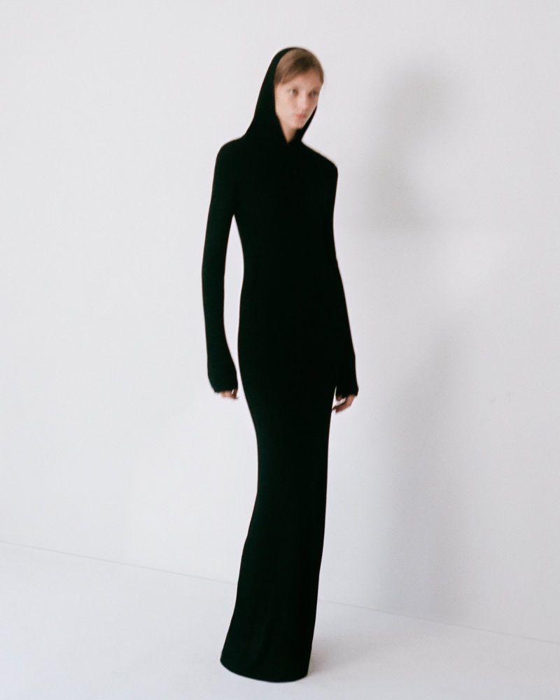 Model wearing a long black hooded dress against a plain white background for the Colleen Allen Spring Summer 2027 collection.