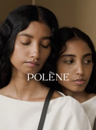Two south asian women wearing white tops with closed eyes against a neutral background for Polène Boky campaign