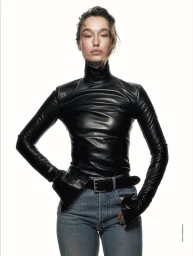 Model in black leather turtleneck and blue jeans against a white background for Elle Italia