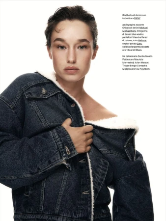 Model Jenn du Puy wearing a dark blue denim jacket with white sherpa lining against a plain white background