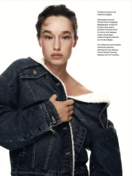 Model Jenn du Puy wearing a dark blue denim jacket with white sherpa lining against a plain white background