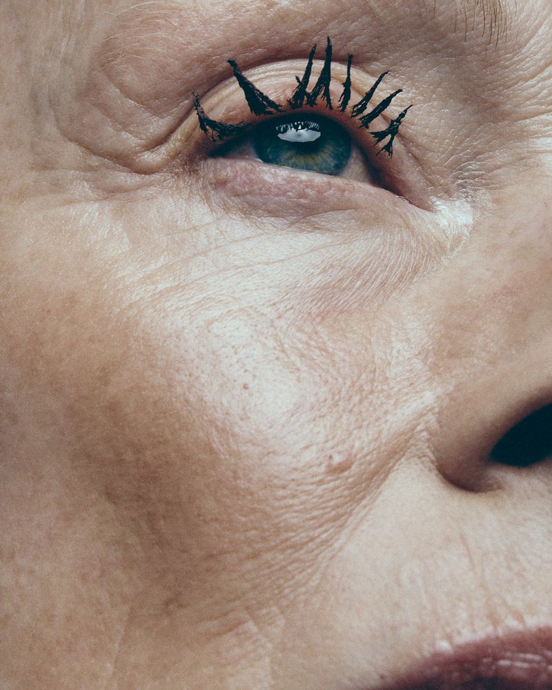 Macro close-up portrait of an eye with heavy textured mascara and detailed skin texture for Vogue Portugal