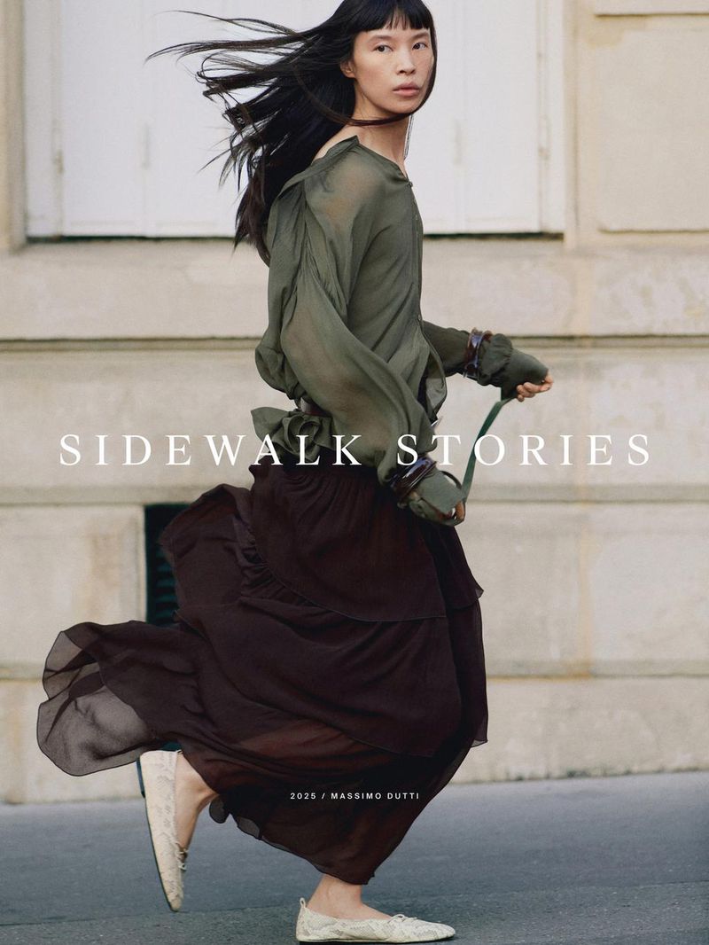 Fashion editorial featuring an Asian adult female model wearing a flowing olive green blouse and brown skirt on a city street with text overlay.
