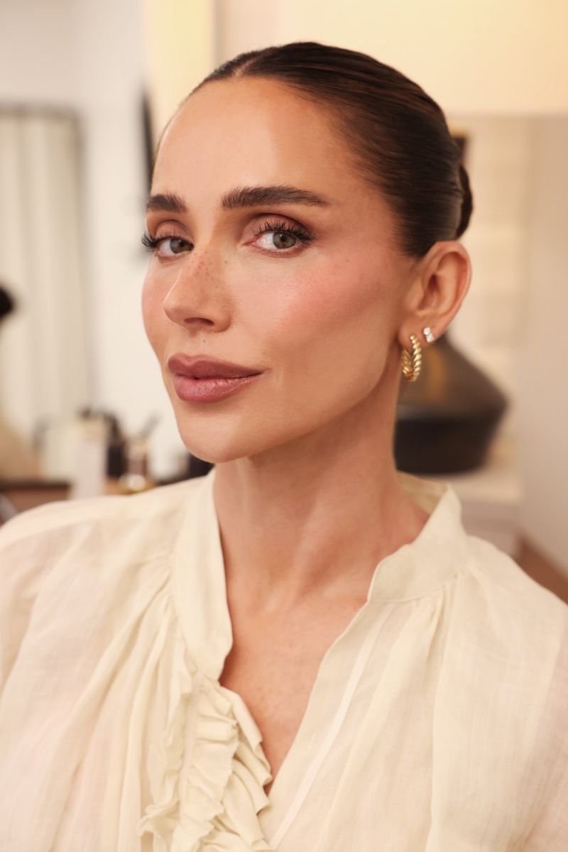 Close-up portrait of Mary Phillips wearing a cream blouse and gold hoop earrings for La Mer The Concentrate Confessions project