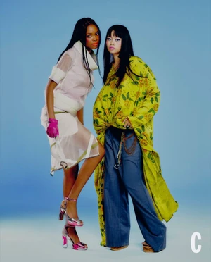Two fashion models posing against a solid blue background for Cosmopolitan UK Not On The Runway project