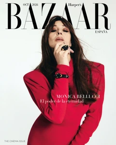 Monica Bellucci wearing a red dress against a plain white background for Harper's Bazaar España