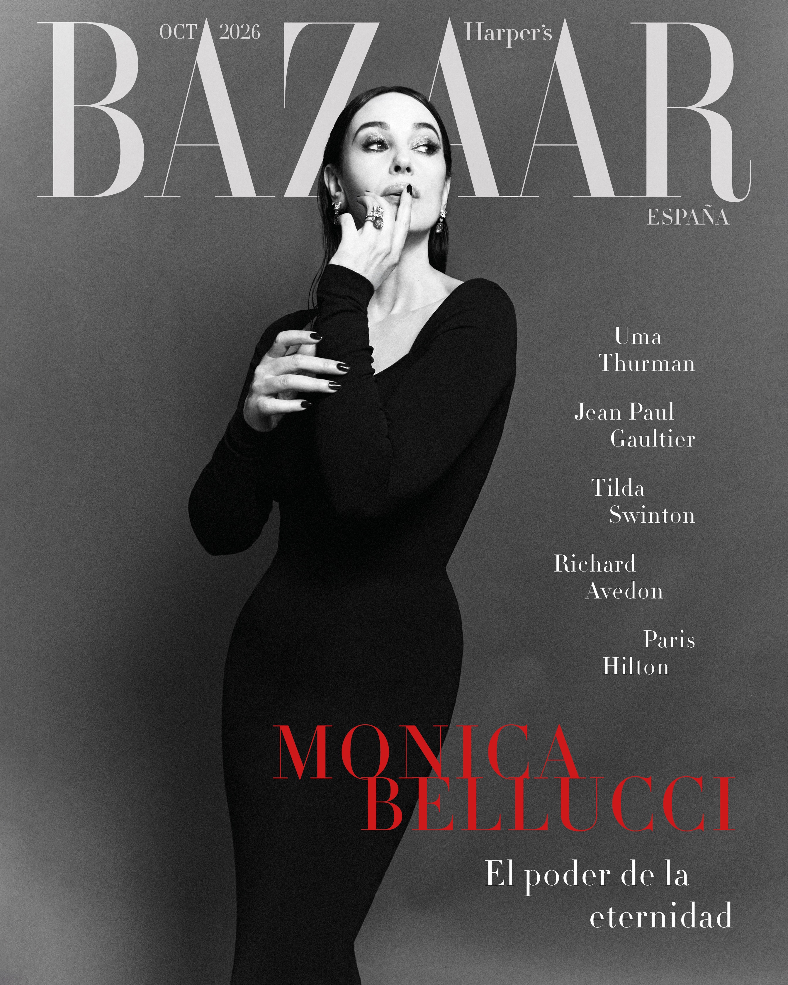 Monica Bellucci on the cover of Harper's Bazaar Espana wearing a long black dress against a grey studio backdrop