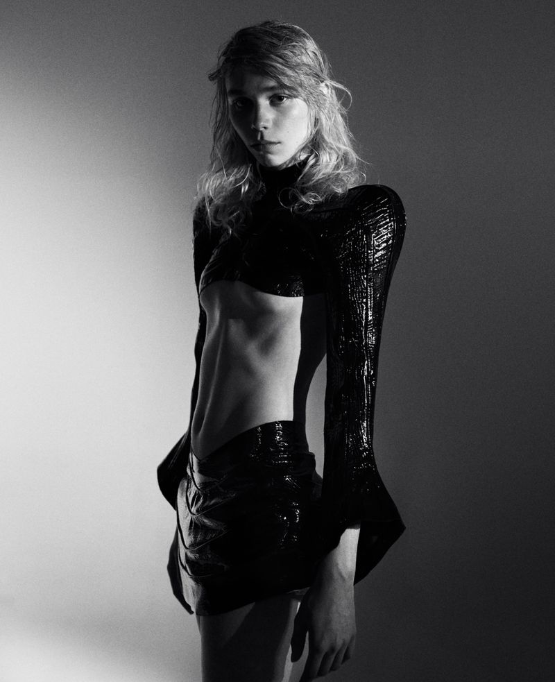 Model in black textured top and skirt against a grey studio backdrop, photographed by Marlen Keller for theBallroom.