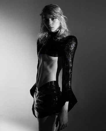 Model in black textured top and skirt against a grey studio backdrop, photographed by Marlen Keller for theBallroom.