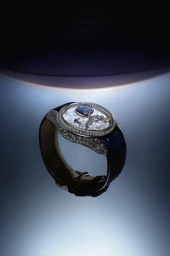 Luxury diamond-encrusted wristwatch with blue strap on gradient blue background for Orbital project by Nu Icons