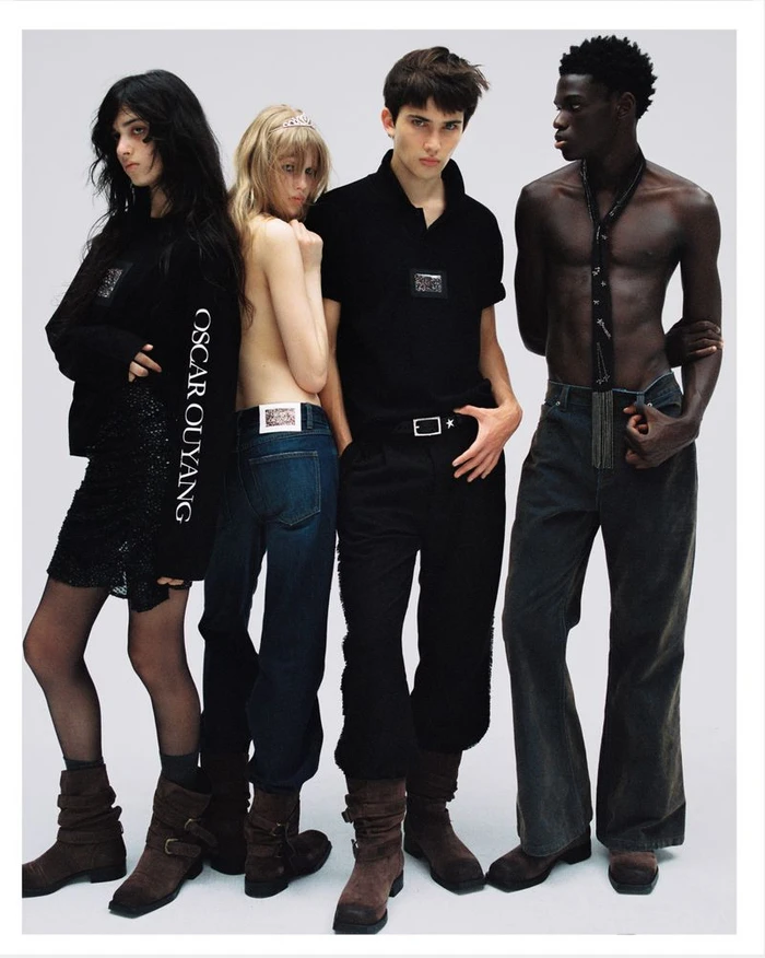 Four models posing together against a plain grey backdrop for Oscar Ouyang X Pull and Bear fashion campaign.