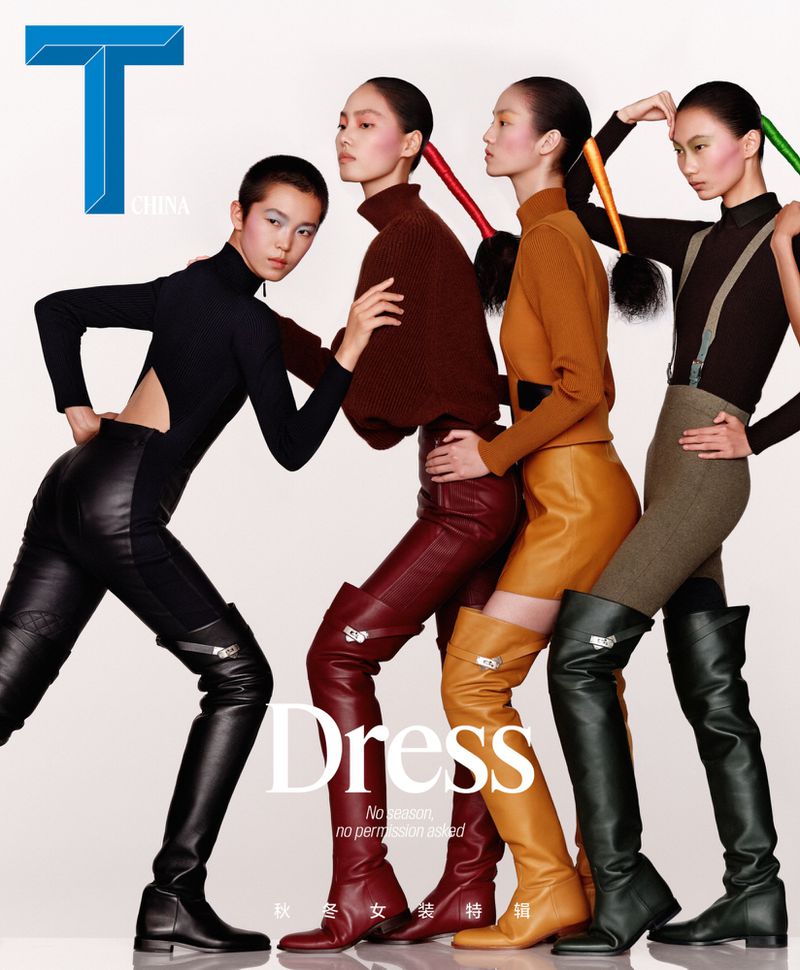 Group of four female models in coordinated autumn outfits and tall leather boots against a white studio background.