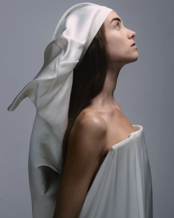 Model Grace Hartzel wearing white draped fabric head covering and dress in Pop Magazine editorial by Oliver Hadlee Pearch.