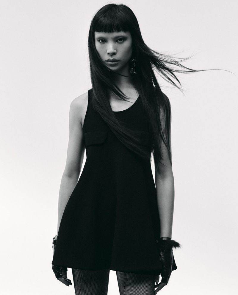 Model Diane Chiu in a black sleeveless dress against a white background for Rouge Fashionbook