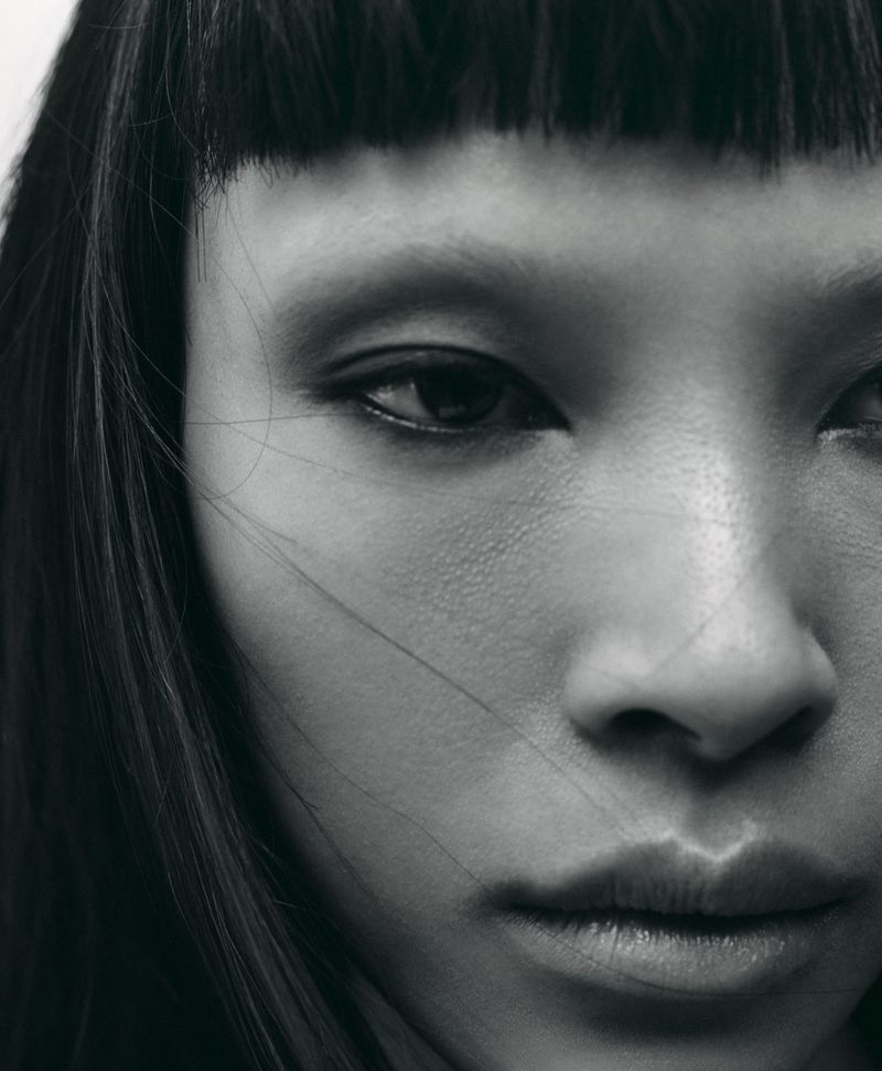 Close-up monochrome portrait of model Diane Chiu with straight bangs and dark hair for Rouge Fashionbook editorial by Arseny Jabiev.