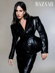 Model Taleedah Tamer wearing a black textured suit in a Harper's Bazaar Arabia fashion editorial