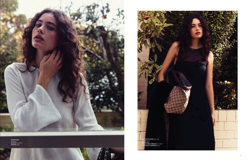 A two-page editorial layout showing a woman with long dark curly hair wearing a white blouse and a black dress outdoors near foliage.