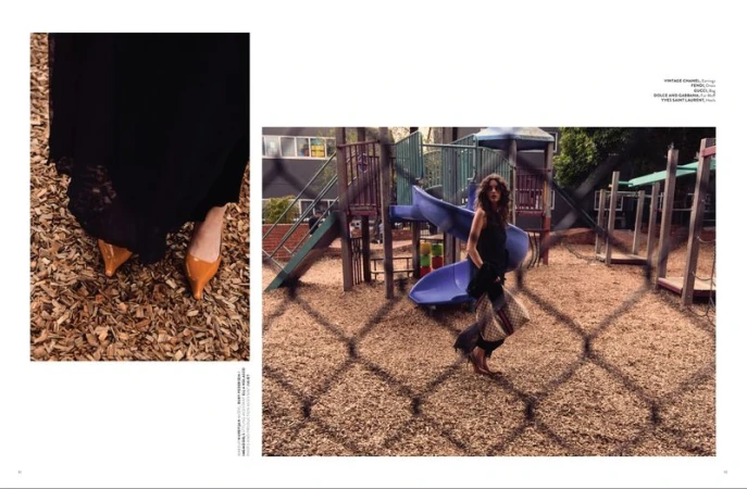 Model standing on a playground with woodchip ground behind a chain-link fence, with a close-up inset of yellow shoes.