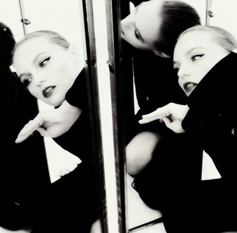 Model Fran Summers in black attire reflected across multiple mirrors in a high-contrast editorial portrait for Numero Istanbul.