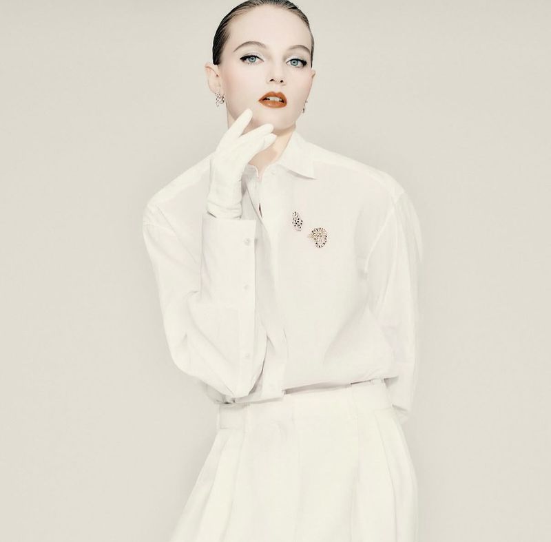 Fran Summers in a white buttoned shirt and white gloves for Numéro Istanbul