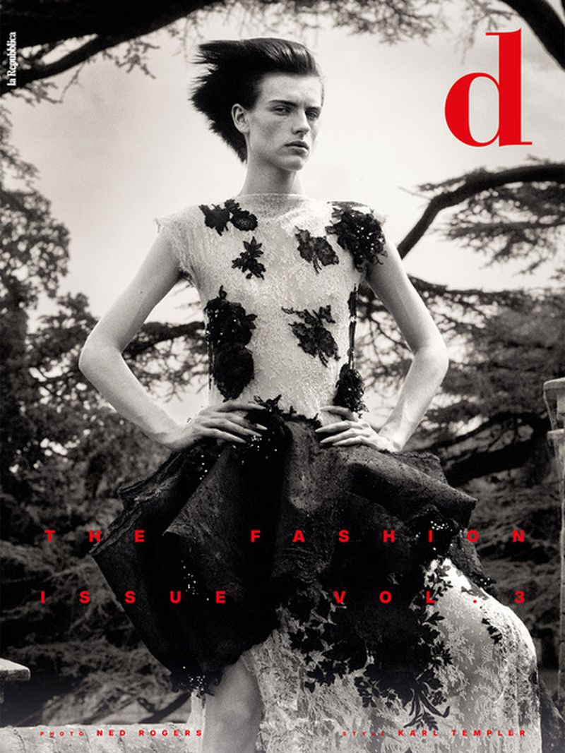 Model wearing a white and black lace dress posing outdoors under trees for D Repubblica