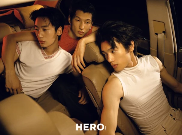 Three young men posed inside a car interior with warm directional lighting for HERO Magazine editorial