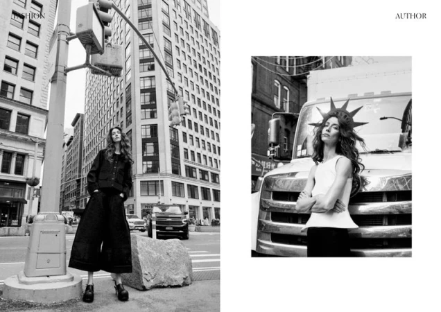 Black and white fashion shot of a woman in dark clothing in a city street with tall buildings, with a truck and a crown-wearing woman nearby.