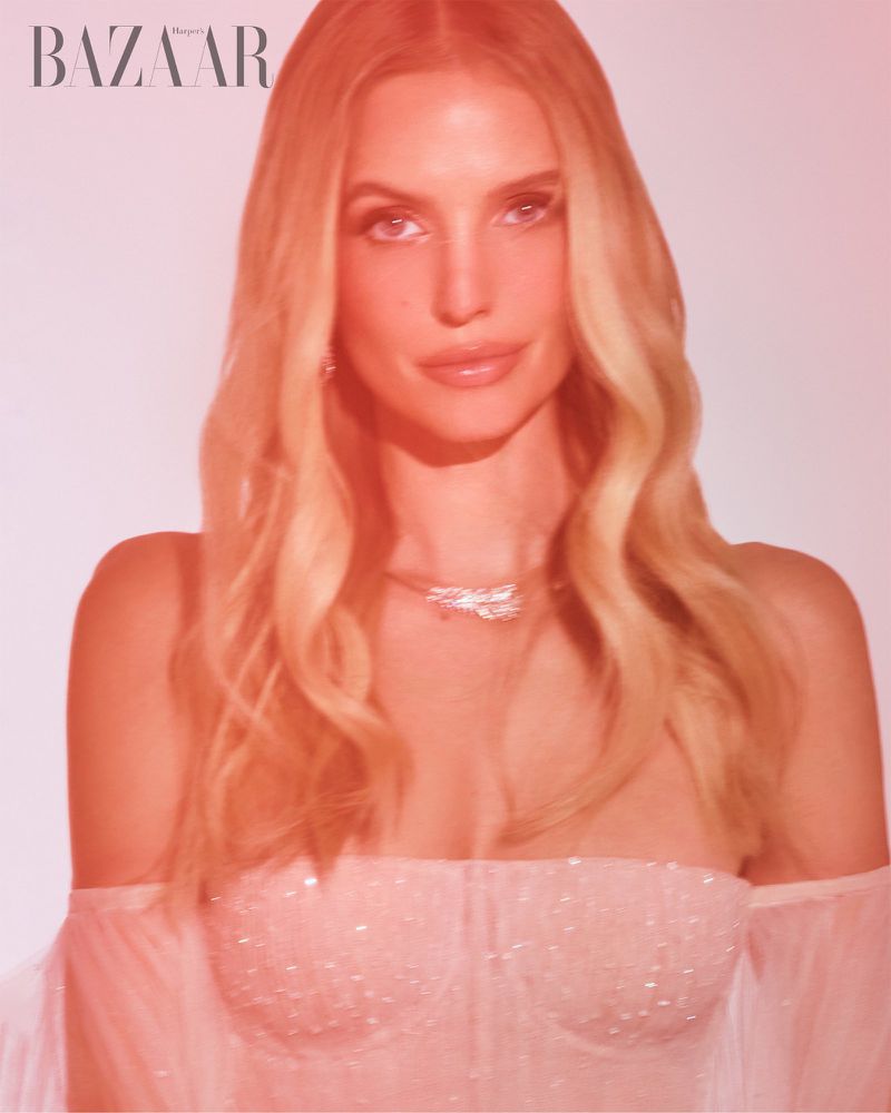 Portrait of blonde woman wearing an off-the-shoulder gown for Harper's Bazaar Vietnam, photographed by Giuseppe Vitariello