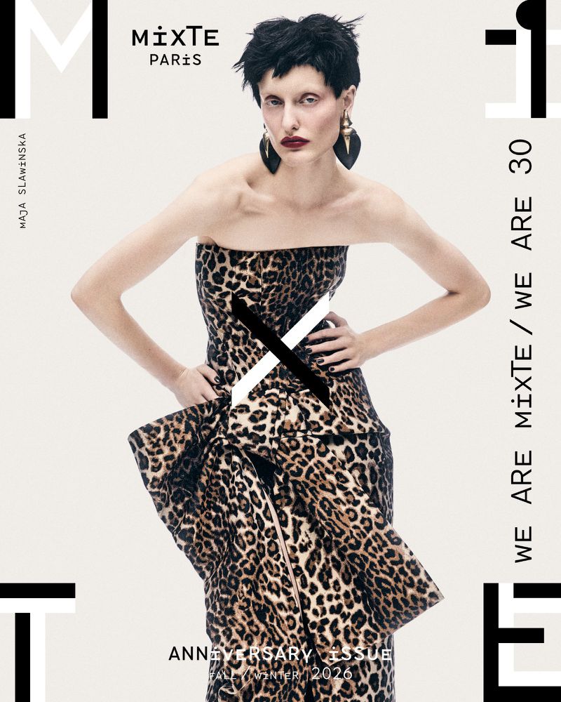 Model in strapless leopard print dress with dark short hair and earrings against a plain white background for Mixte A/W 26 issue