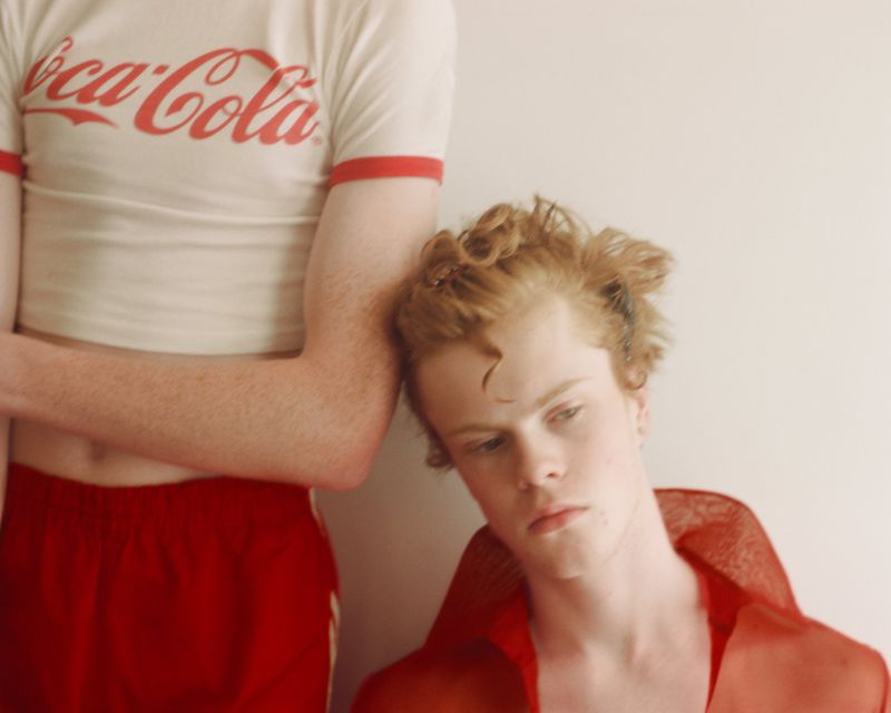 Two young models posing against a plain wall for Office Magazine editorial Nature of Adolescence shot by Bex Day.