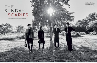 Black and white fashion editorial spread featuring four models posing outdoors on a grassy lawn beneath large trees in bright sunlight.