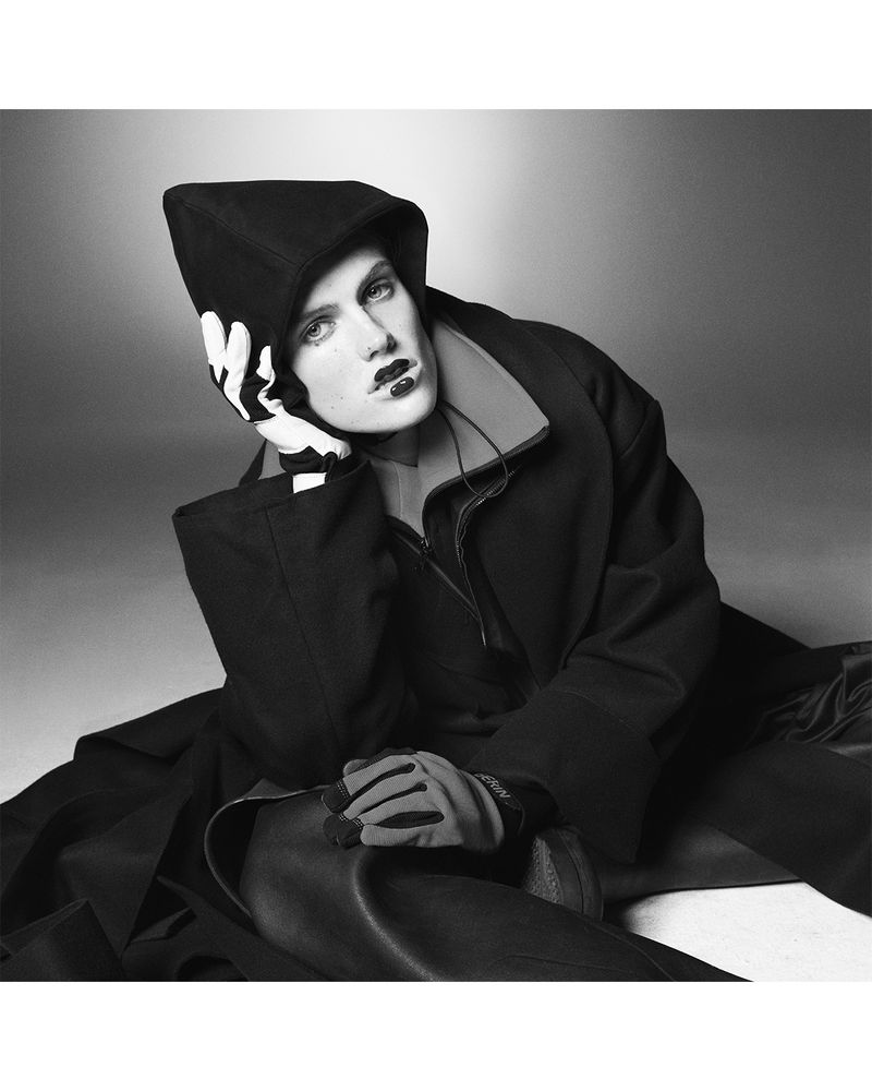 Lucia Richardson in a hooded black coat and gloves posing for D Repubblica photographed by Theo Sion