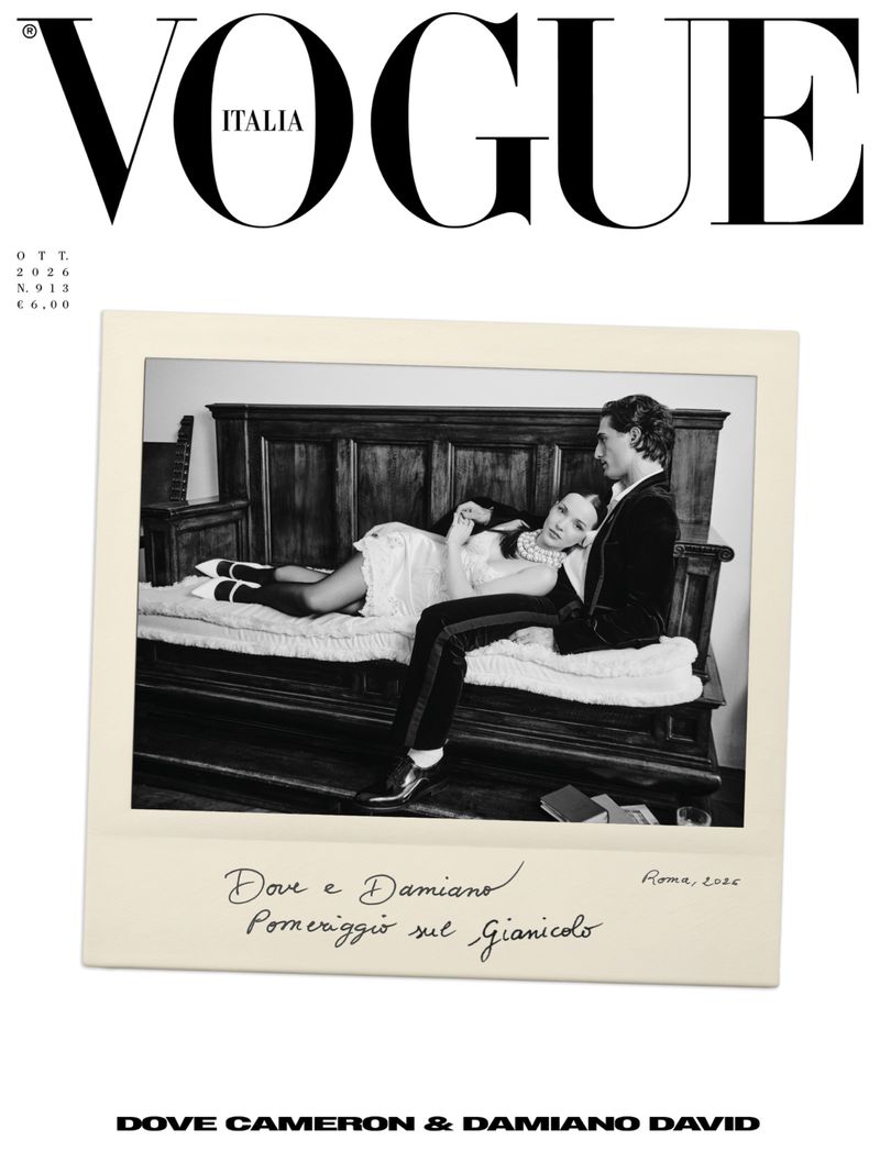 Vogue Italia October 2026 magazine cover featuring a black and white polaroid of Dove Cameron and Damiano David on an antique bench.