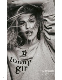 Close-up portrait of model Kim Riekenberg wearing a grey sweatshirt with tommy girl branding for Grazia Germany.