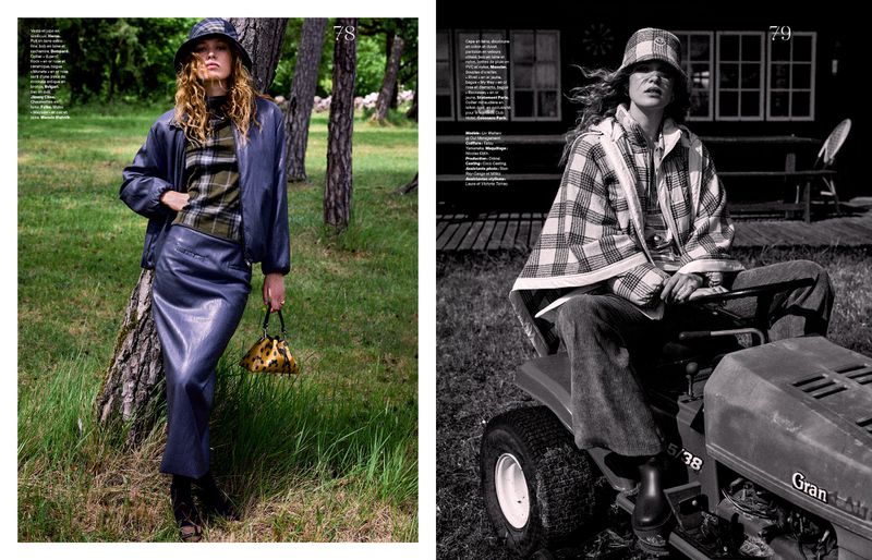 Model Liv Walters in a blue leather jacket and matching skirt standing in a grassy woodland for Les Echos