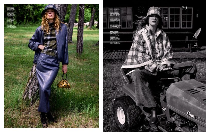 Model Liv Walters in a blue leather jacket and matching skirt standing in a grassy woodland for Les Echos
