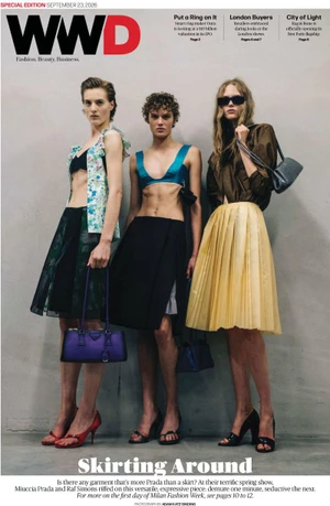 Three female models posing in designer clothing against a plain background for WWD magazine cover