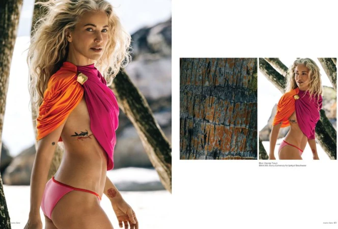 Blonde woman wearing a vibrant pink and orange draped top and bikini on a sandy beach for Marie Claire Turkey July 2026 cover.
