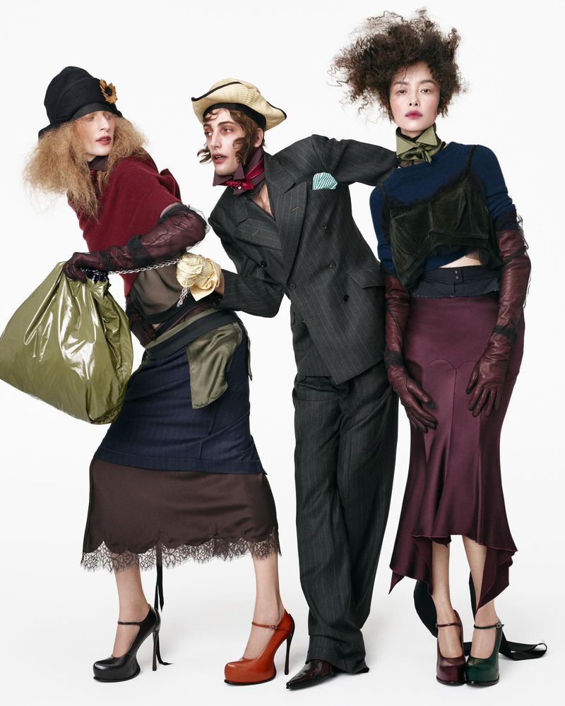 Three models in avant-garde layered fashion against a bright white seamless studio background by Steven Meisel for Zara