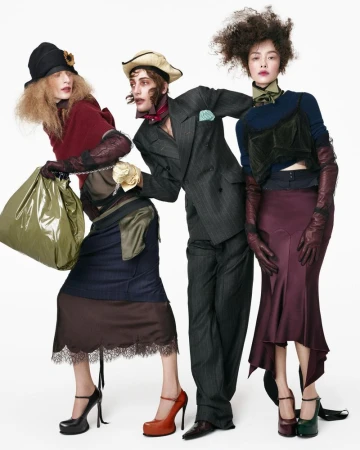 Three models in avant-garde layered fashion against a bright white seamless studio background by Steven Meisel for Zara