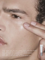 Close-up portrait of a male model applying MAC Cosmetics product to cheekbone for the Lustreglass 2026 Campaign