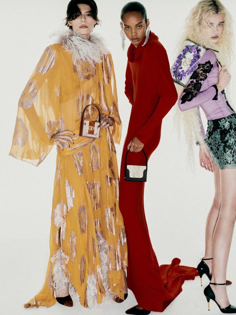 Three models in vibrant dresses posing against a plain white studio background for a Harper's Bazaar Brazil fashion editorial.