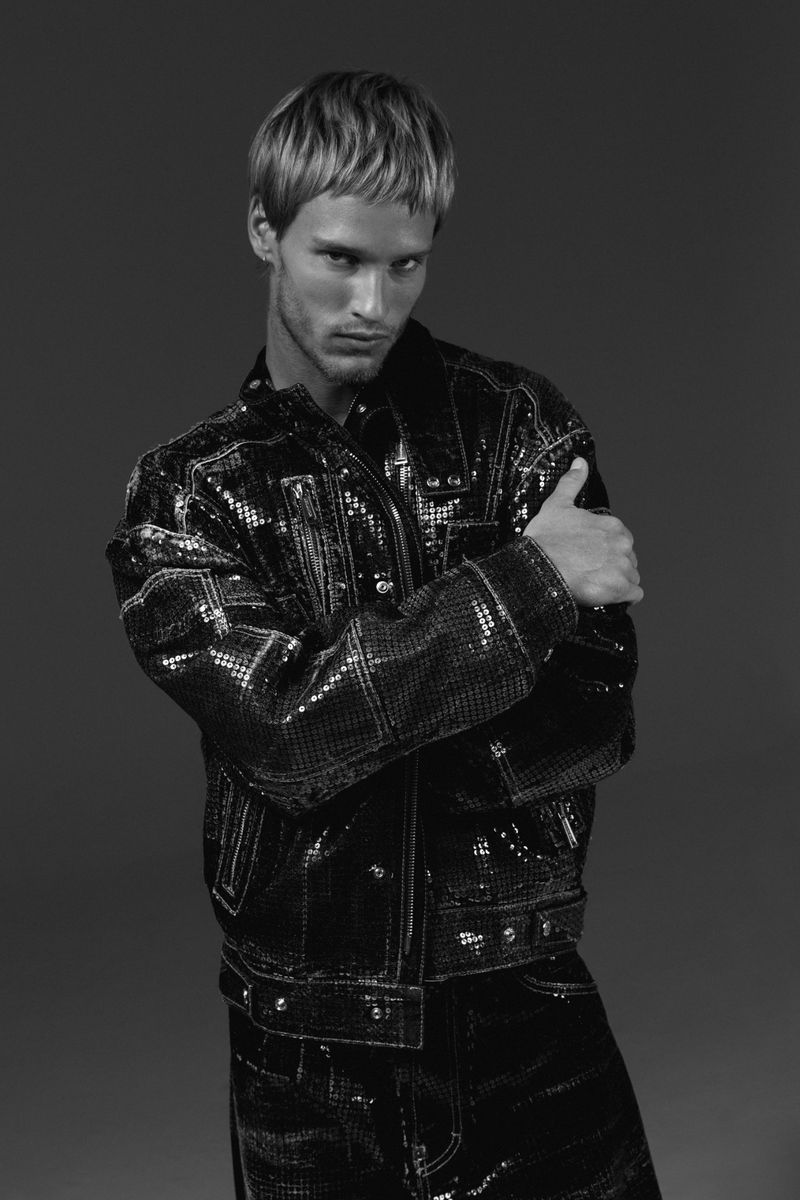 Model Yeray Allgayer in a black sequined jacket against a dark studio background for Numero Netherlands.