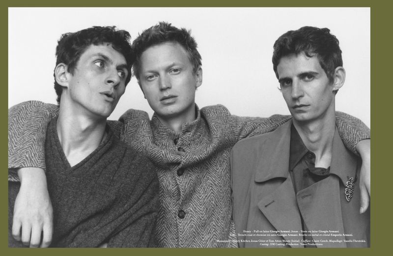 Three male models posing together in textured wool knitwear against a plain light studio background for Harper's Bazaar France Homme.