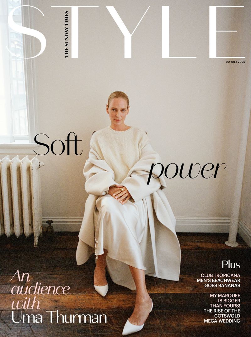 Magazine cover featuring a woman in an off-white outfit, seated against a wall, with fashion and lifestyle articles listed.