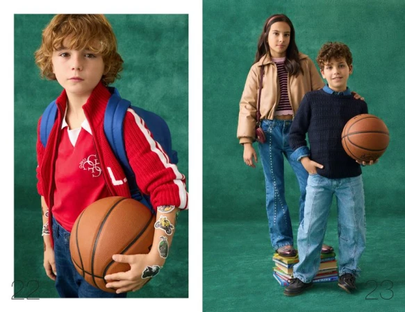 Two children holding basketballs posing against a textured green studio background for Guess Kids Pre-Fall 2026.