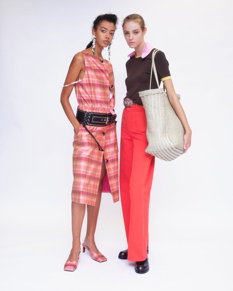 Two female models posing against a white background wearing Altuzarra Spring Summer 2027 collection looks
