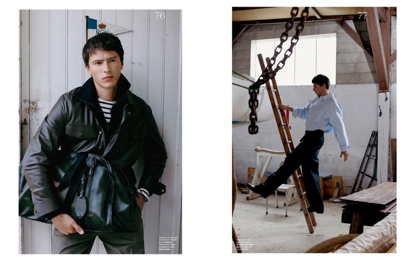 Editorial spread featuring a man in a dark leather jacket holding a large duffel bag against white wood paneling.