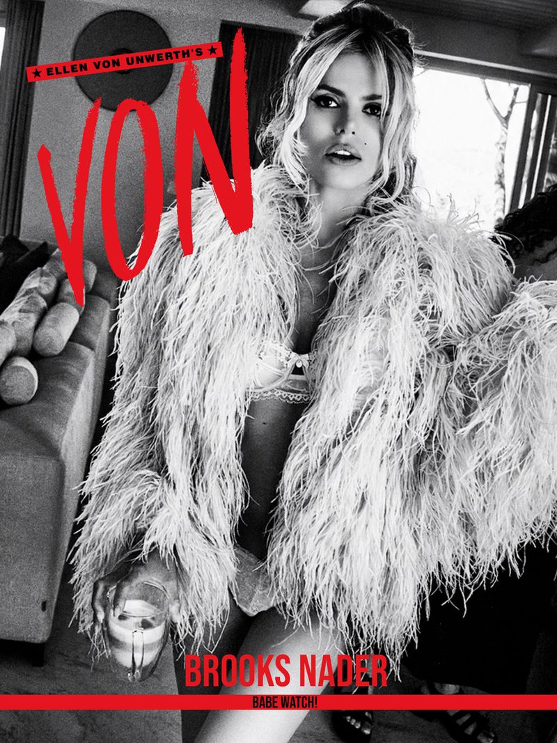 Model Brooks Nader wearing a feather coat and lingerie holding a drink in a black and white editorial by Ellen von Unwerth for Von Magazine.